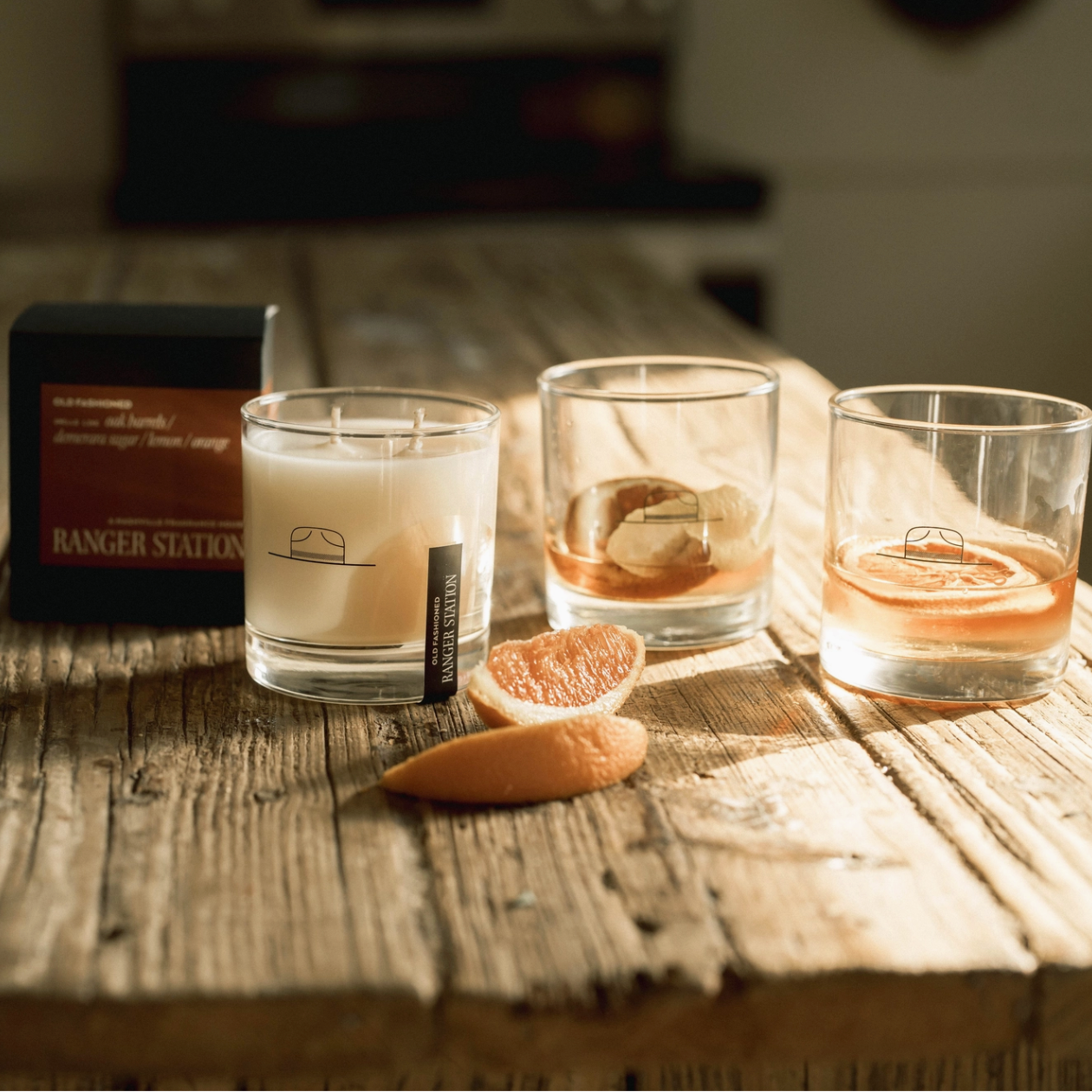 Three glasses with different liquids on a wooden surface, with a box labeled 'Ranger Station' in the background.