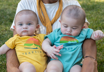 Traveler Baby Logo Onesie